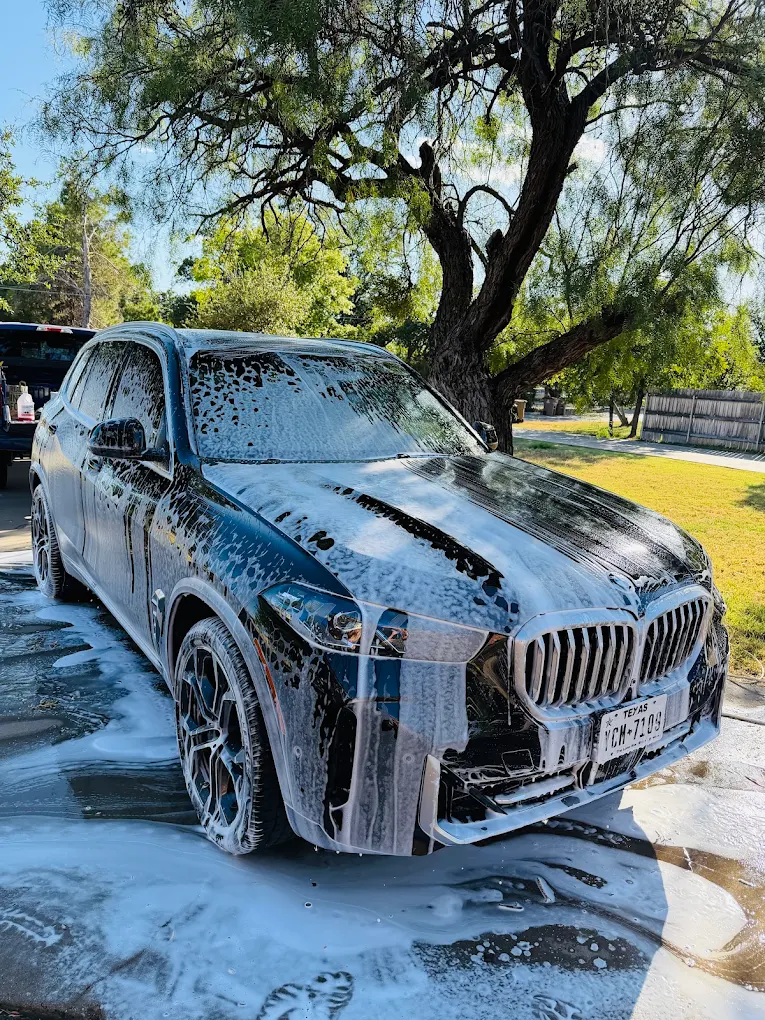 BMW SUV covered in foam during a Velocity exterior wash